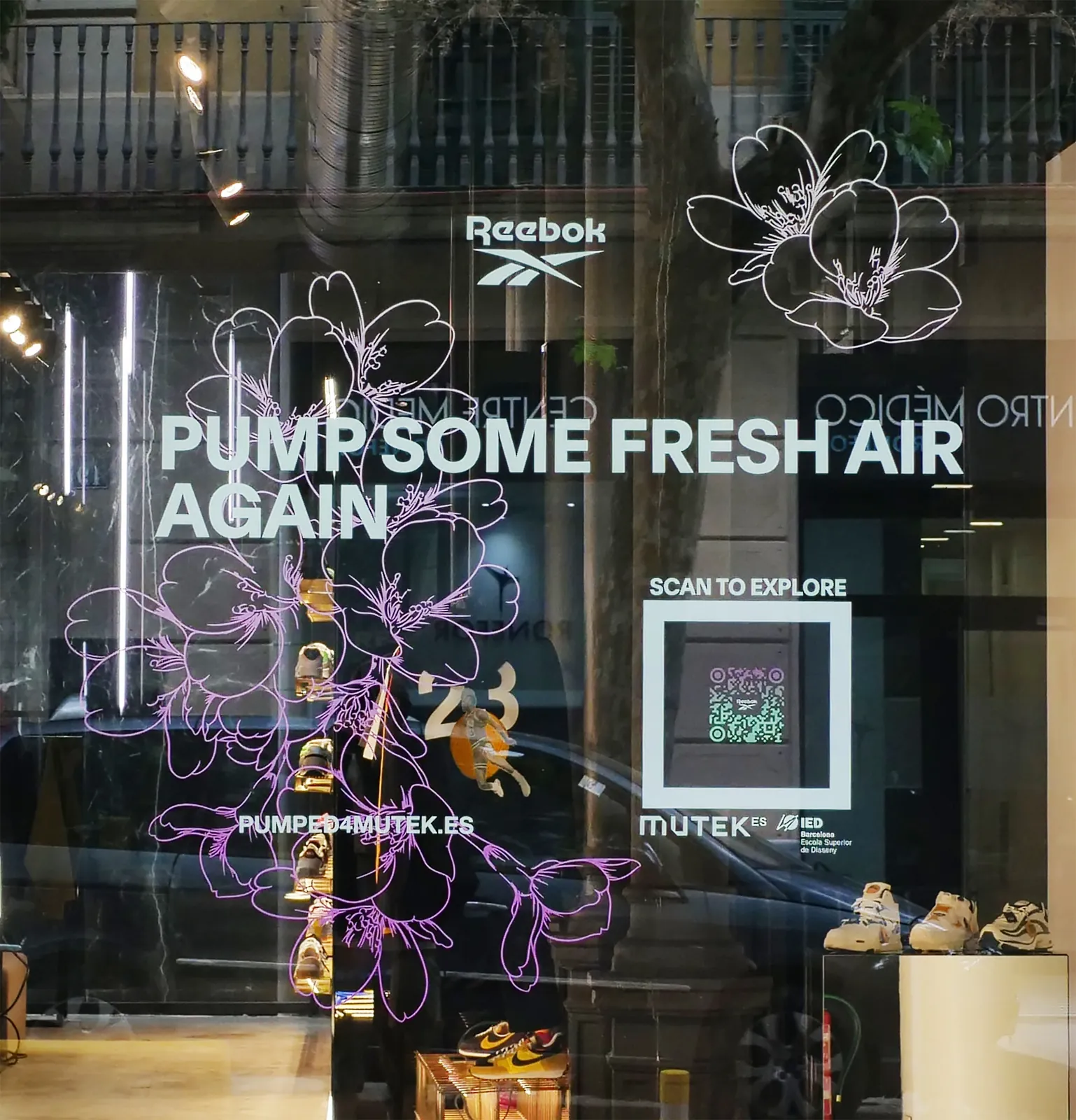 Final installed vinyl decal on SVD's storefront window at night