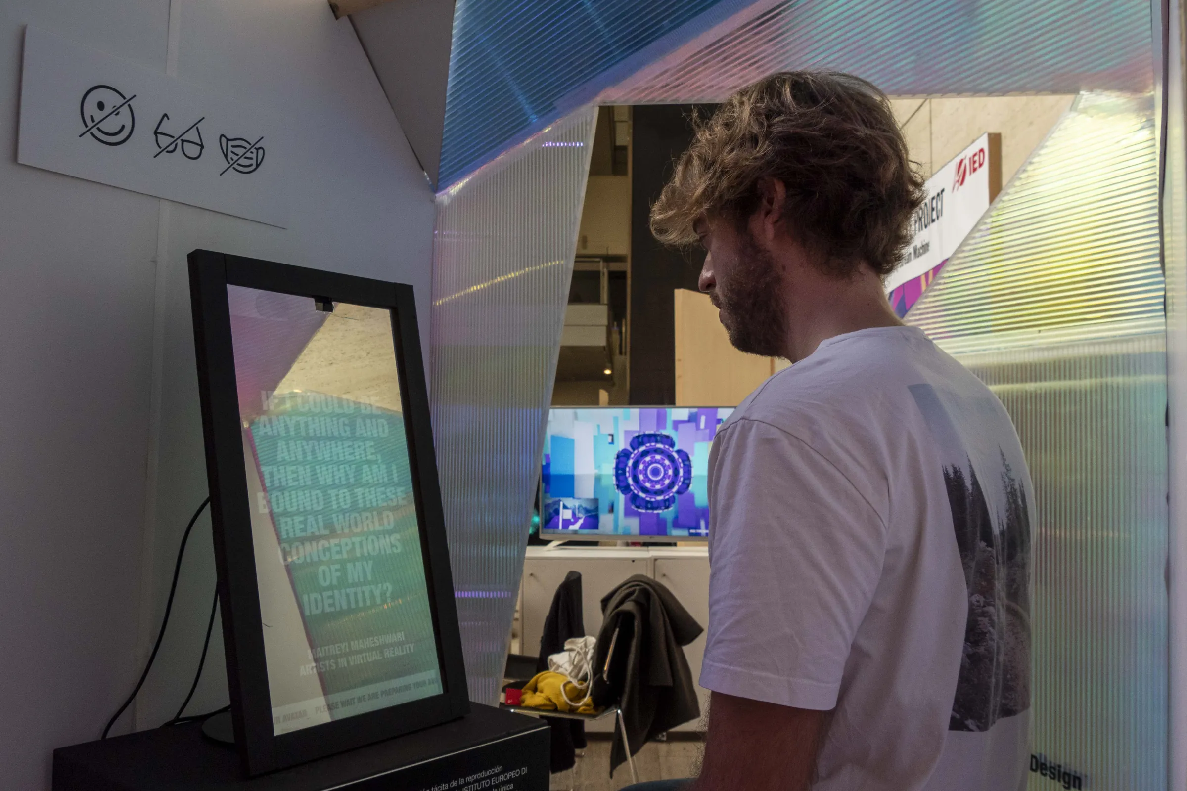 Visitor reading the mirror screen's identity quote